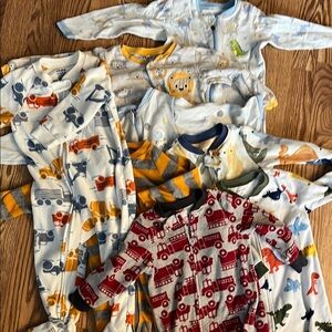 8 Assorted Baby Onesies - Various Designs. 3 cotton, 5 fleece